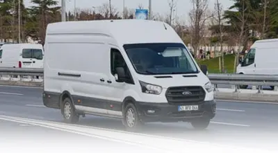 White delivery van on highway road
