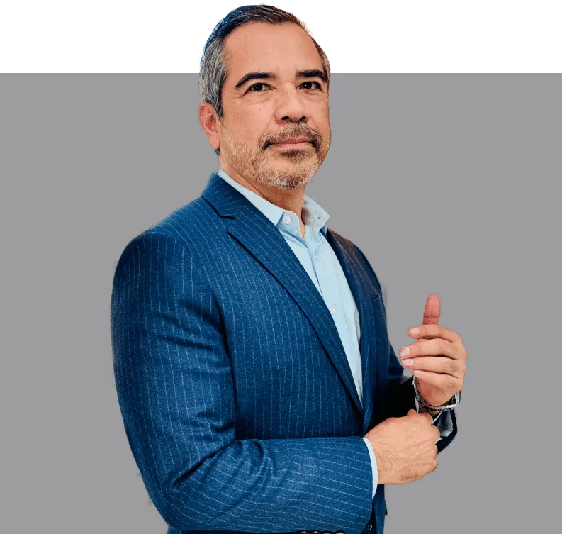 Man in a blue suit posing confidently.