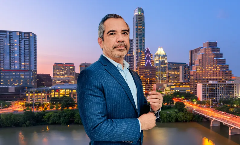 Man in suit with city skyline backdrop.